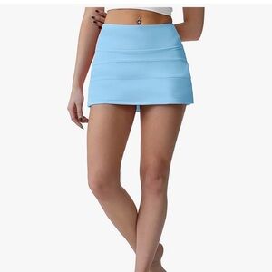 High Waisted Pleated Tennis Skirt with built in biker shorts. Size 4. Like new
